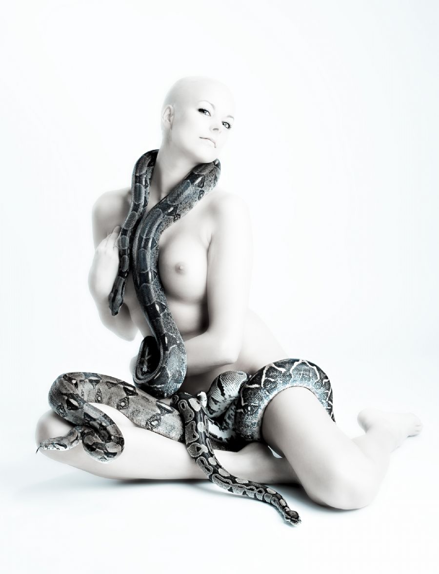 Nude girl with more snakes..