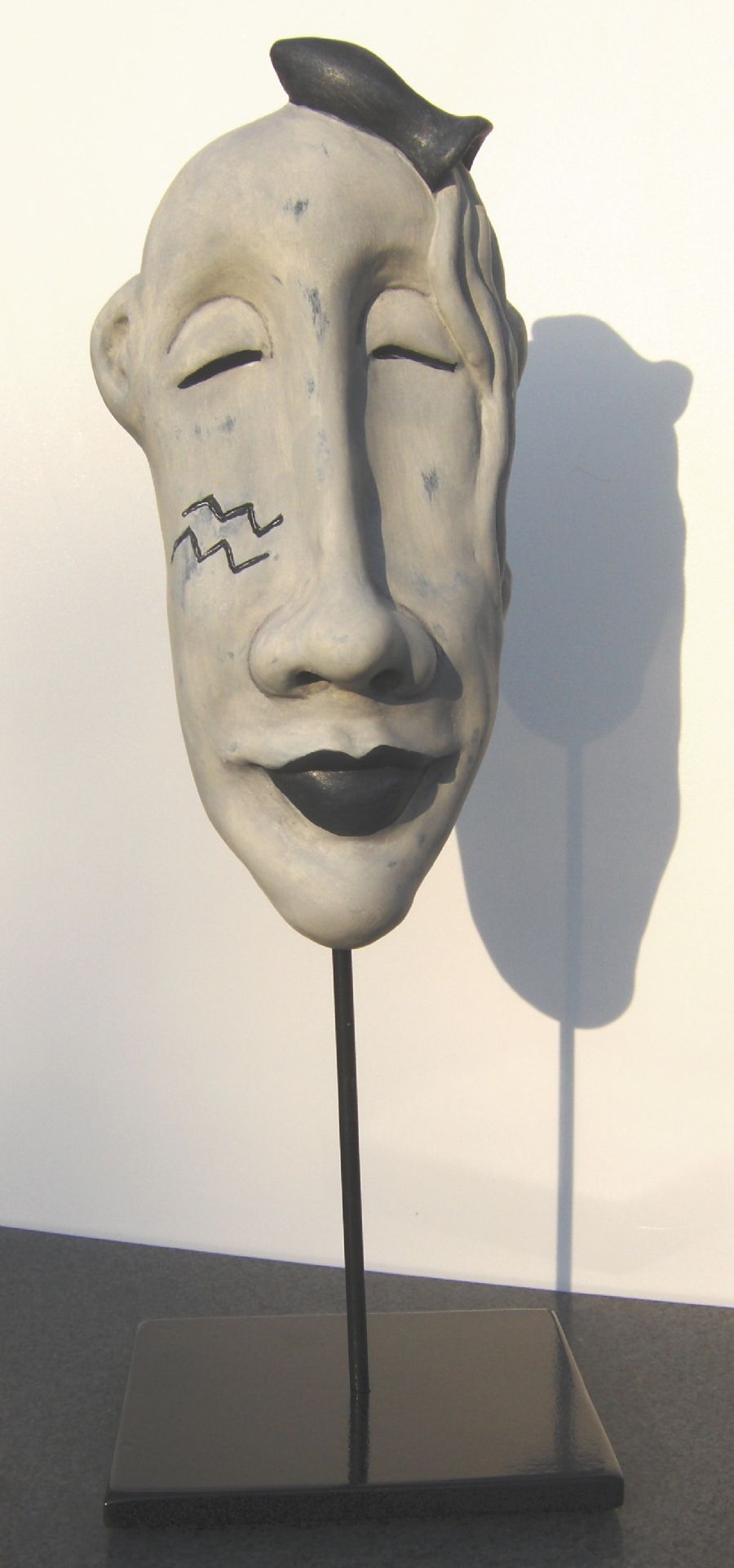 Stjernetegn som maske. Vandmanden